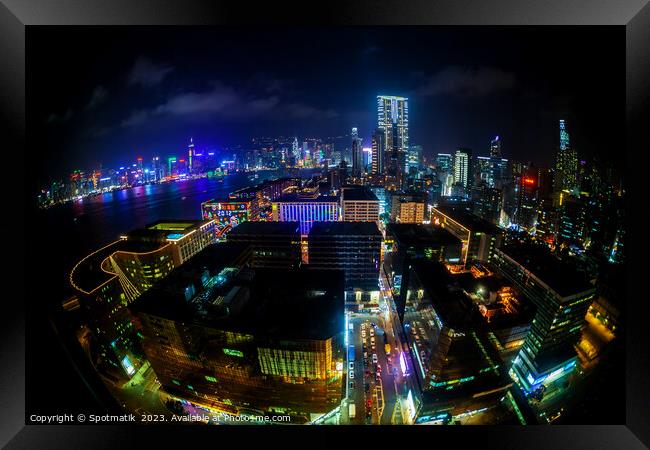 Hong Kong illuminated city traffic and skyscrapers downtown  Framed Print by Spotmatik 