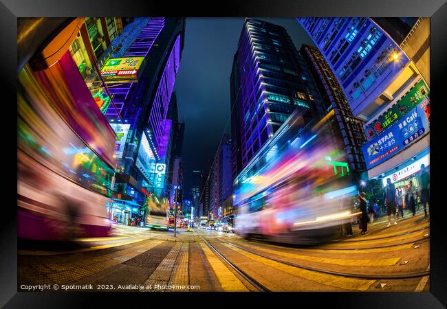Hong Kong illuminated busy street intersection Kow Framed Print by Spotmatik 