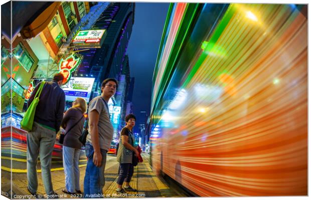Hong Kong illuminated busy vehicle intersection Ko Canvas Print by Spotmatik 