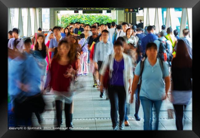 Asian city commuters walking to work Hong Kong Framed Print by Spotmatik 