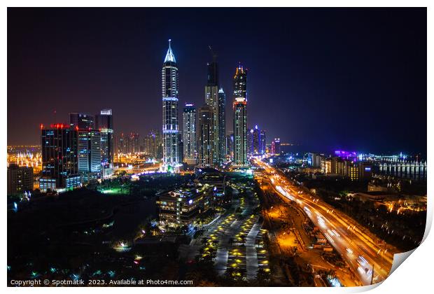 Night Dubai illuminated view of modern city Skyscrapers Print by Spotmatik 