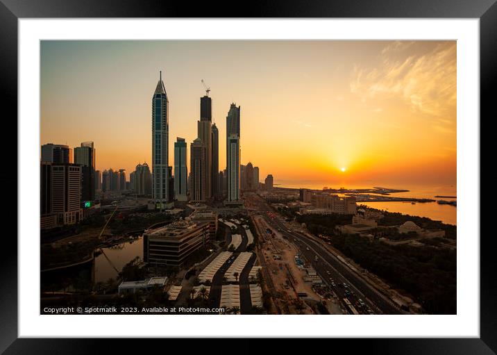 Dubai sunset Sheikh Zayed Road Media city skyscrapers  Framed Mounted Print by Spotmatik 