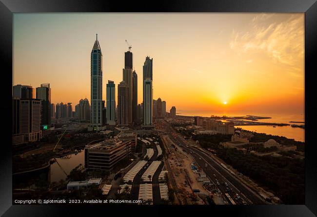 Dubai sunset Sheikh Zayed Road Media city skyscrapers  Framed Print by Spotmatik 