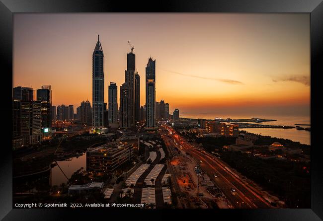 Dubai sunset Sheikh Zayed Road Media city skyscrapers  Framed Print by Spotmatik 