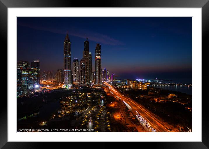 Dubai dusk illuminated view Sheikh Zayed city skyscrapers  Framed Mounted Print by Spotmatik 