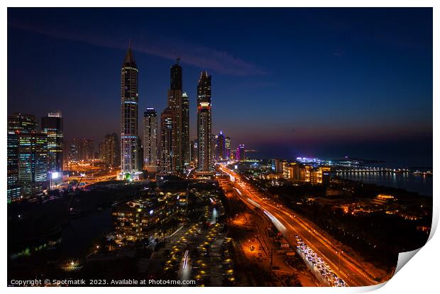 Dubai dusk illuminated view Sheikh Zayed city skyscrapers  Print by Spotmatik 