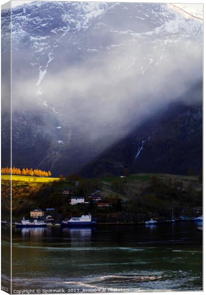 Sunlight beaming though light mist Norwegian glacial fjord  Canvas Print by Spotmatik 