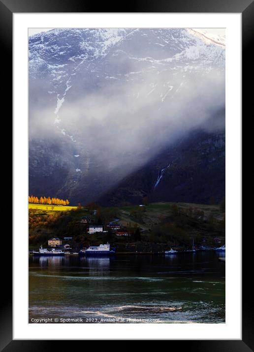 Sunlight beaming though light mist Norwegian glacial fjord  Framed Mounted Print by Spotmatik 