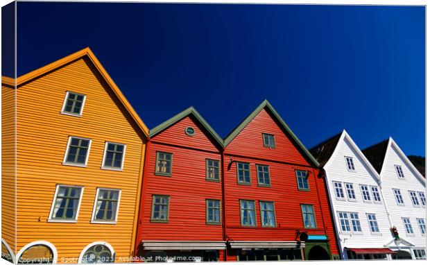 Bergen Norway a colorful wooden clad boat houses  Canvas Print by Spotmatik 