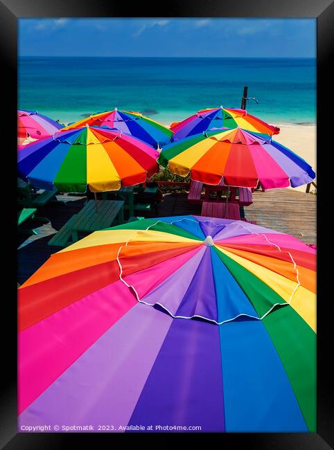 Colorful beach umbrellas in the tropical sunshine Caribbean Framed Print by Spotmatik 