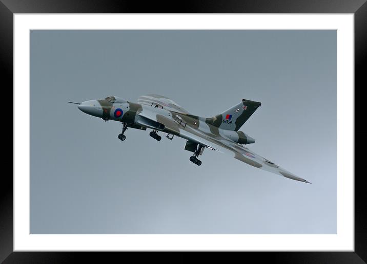 Avro Vulcan XH558 in moody skies Framed Mounted Print by Andrew Scott