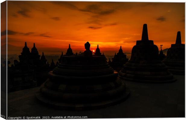 Sunrise over Borobudur a religious ruined temple Java  Canvas Print by Spotmatik 