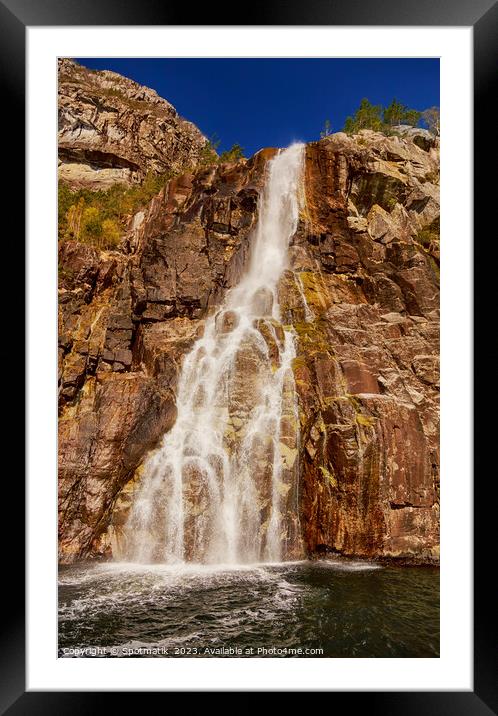 View of Norwegian waterfall cascading into Lysefjorden fjord  Framed Mounted Print by Spotmatik 