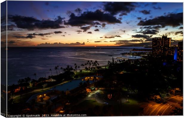 Waikiki sunset illuminated view at dusk Pacific ocean Canvas Print by Spotmatik 