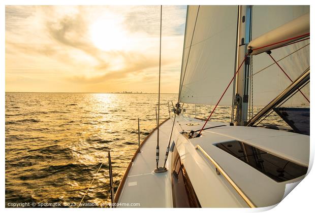 Sailing private yacht towards city skyline at sunrise Print by Spotmatik 