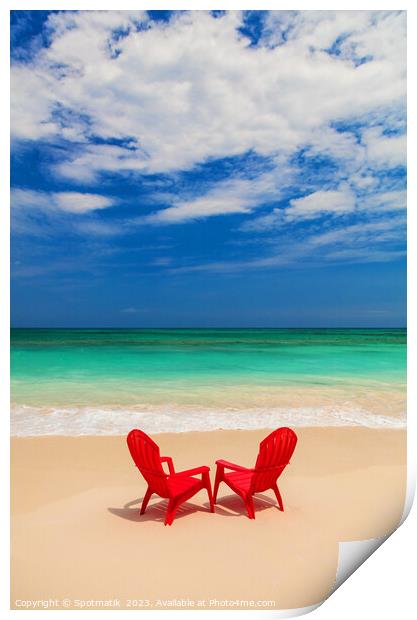 Red chairs on sandy beach by ocean Bahamas Print by Spotmatik 