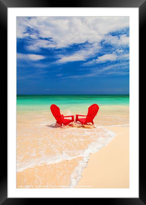 Red chairs on shoreline of sandy beach Bahamas Framed Mounted Print by Spotmatik 
