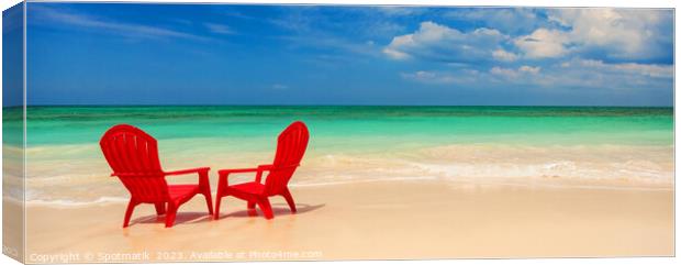 Panoramic red travel chairs on white sandy beach Canvas Print by Spotmatik 
