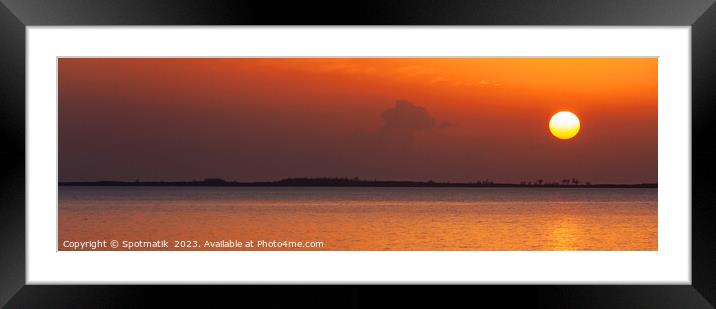 Panoramic ocean view at sunset with orange sky Framed Mounted Print by Spotmatik 