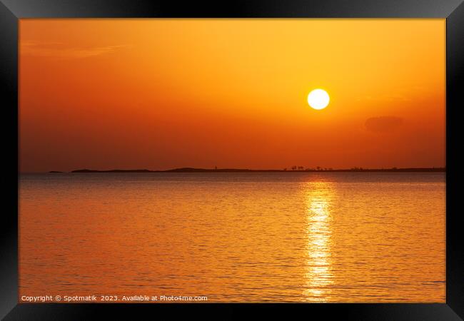 Caribbean island seascape with sunset sky Framed Print by Spotmatik 