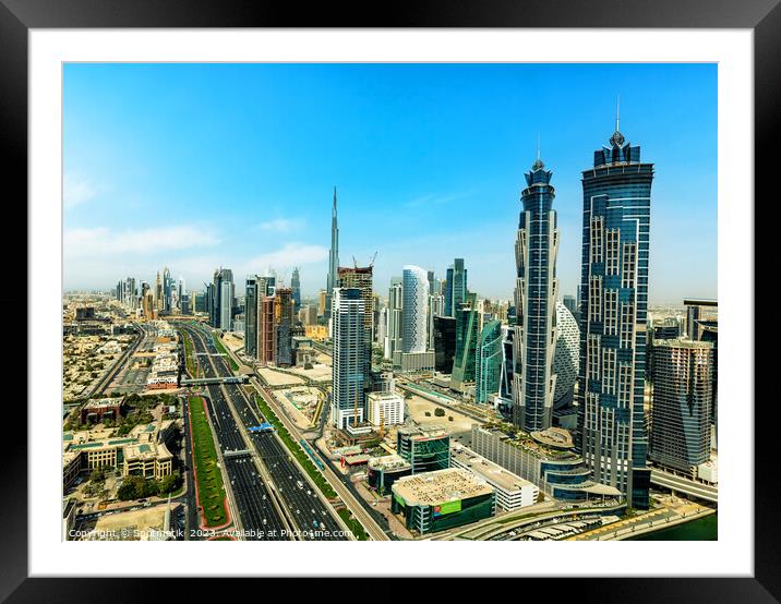 Aerial view Dubai city skyscrapers Sheikh Zayed Road  Framed Mounted Print by Spotmatik 