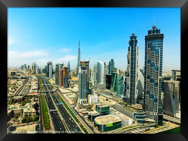 Aerial view Dubai city skyscrapers Sheikh Zayed Road  Framed Print by Spotmatik 