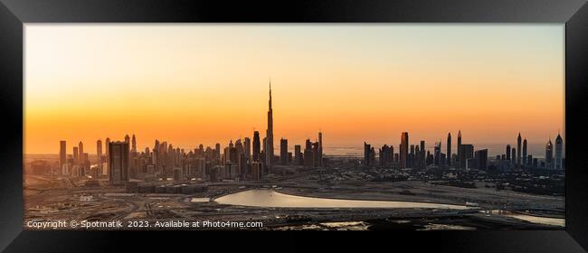 Aerial Panorama sunset Dubai city modern skyscrapers UAE Framed Print by Spotmatik 