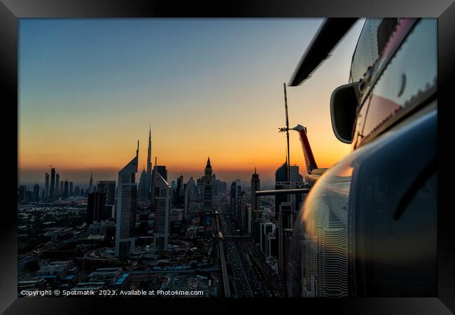 Aerial Dubai sunset helicopter flying Sheikh Zayed Road Framed Print by Spotmatik 