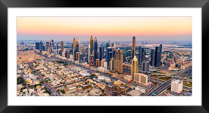 Aerial cityscape sunset view of Dubai city UAE Framed Mounted Print by Spotmatik 