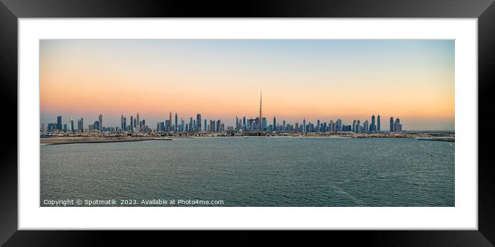 Aerial Panoramic sunset view of Dubai city skyscrapers  Framed Mounted Print by Spotmatik 