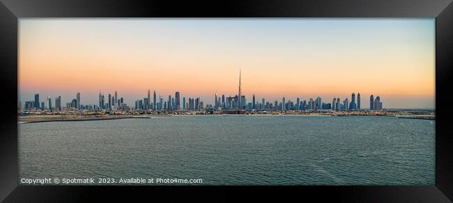 Aerial Panoramic sunset view of Dubai city skyscrapers  Framed Print by Spotmatik 
