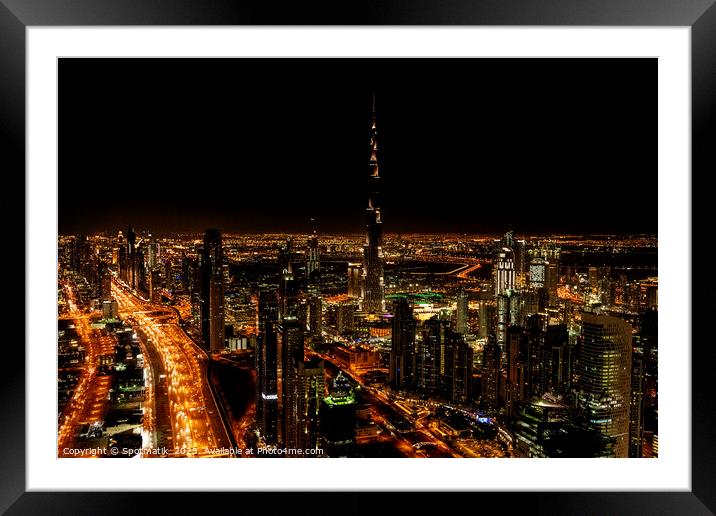 Aerial Dubai illuminated night view of Burj Khalifa  Framed Mounted Print by Spotmatik 