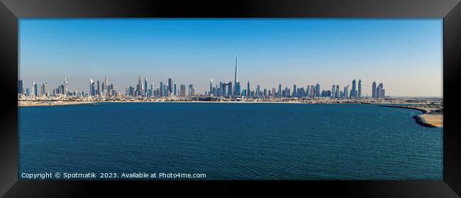 Aerial Panorama coastline cityscape view of Dubai skyscrapers  Framed Print by Spotmatik 