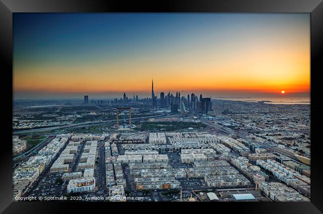 Aerial sunset view of Dubai city skyscrapers UAE  Framed Print by Spotmatik 