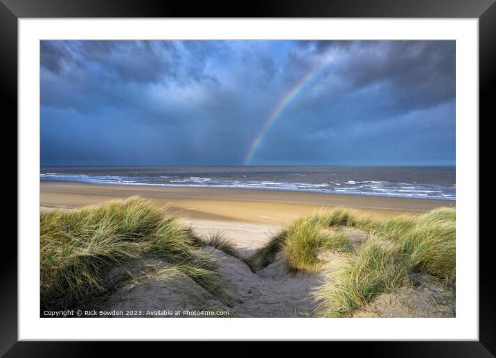 Rainbow over Holkham Bay Dunes. Framed Mounted Print by Rick Bowden