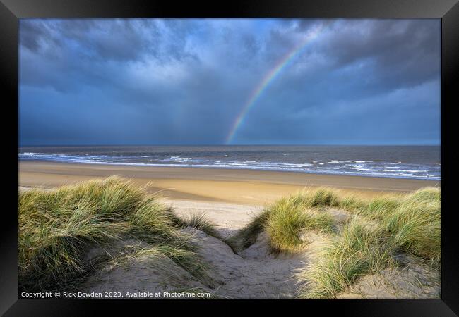 Rainbow over Holkham Bay Dunes. Framed Print by Rick Bowden