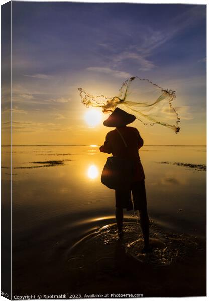 Balinese fisherman casting net Flores sea sunrise Canvas Print by Spotmatik 