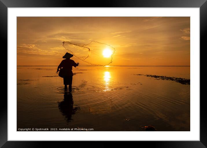 Silhouette Balinese male fishing Indonesian coastline at sunrise Framed Mounted Print by Spotmatik 