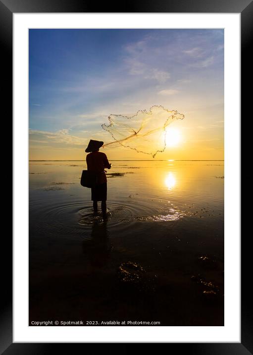 Balinese fisherman casting net Flores sea at sunrise Framed Mounted Print by Spotmatik 