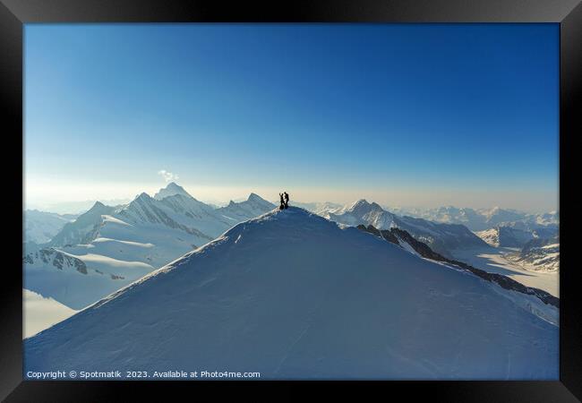 Aerial view Switzerland climbers on mountain summit Europe Framed Print by Spotmatik 