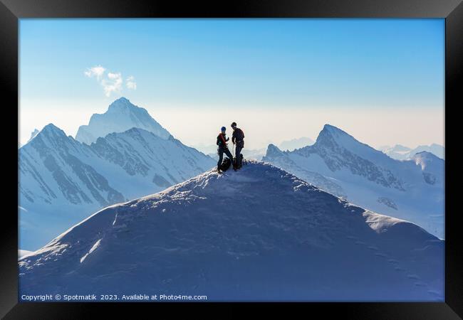 Aerial Switzerland two climbers on snow covered Peak Framed Print by Spotmatik 