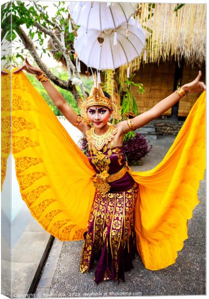 Balinese female dancer performing Ceremonial traditional dance Canvas Print by Spotmatik 