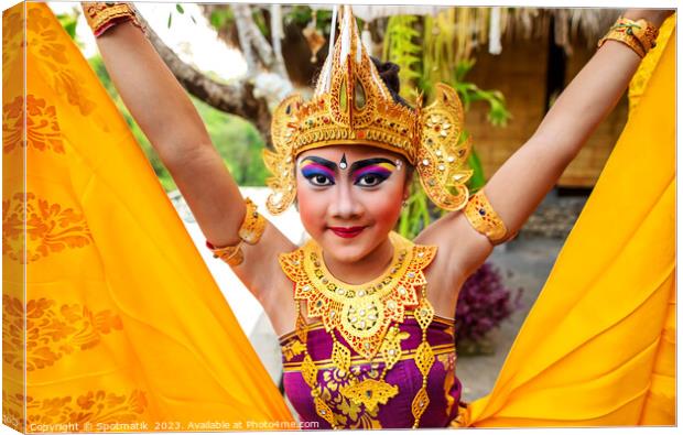 Balinese female dancer performing Ceremonial traditional dance Canvas Print by Spotmatik 