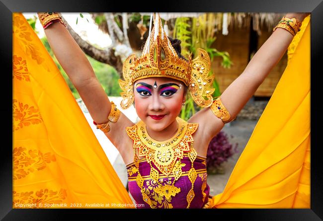 Balinese female dancer performing Ceremonial traditional dance Framed Print by Spotmatik 