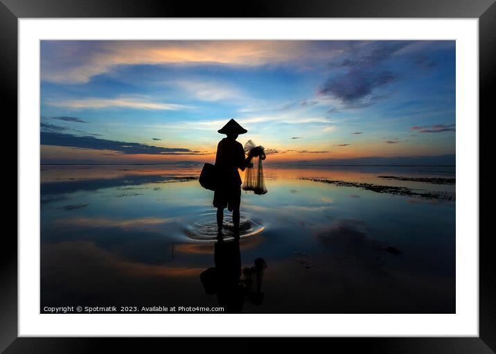 Silhouette Balinese male fishing Indonesian coastline at sunrise Framed Mounted Print by Spotmatik 