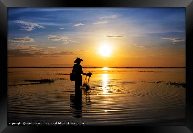 Balinese fisherman at sunrise in Silhouette fishing Asia Framed Print by Spotmatik 