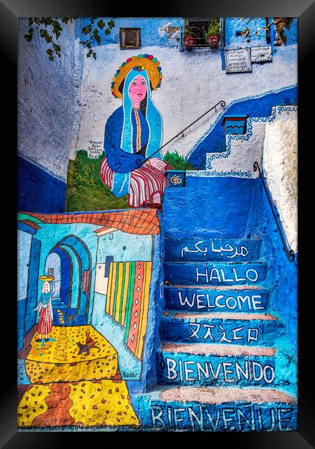 Colorful Graffiti on Moroccan houses in Morocco. Framed Print by Maggie Bajada