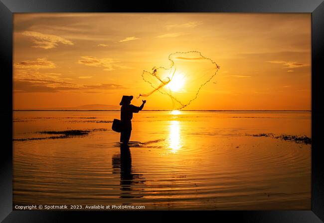 Sunrise Silhouette local Balinese fisherman casting his net  Framed Print by Spotmatik 