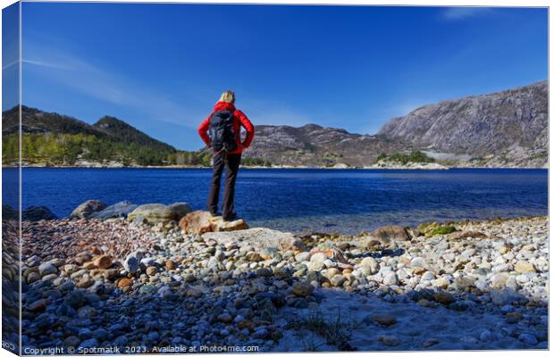 Norway female Hiker scenic beauty of Norwegian fjord  Canvas Print by Spotmatik 