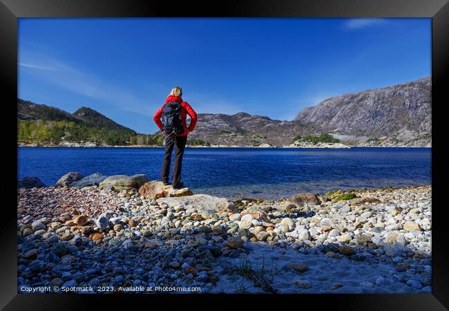 Norway female Hiker scenic beauty of Norwegian fjord  Framed Print by Spotmatik 